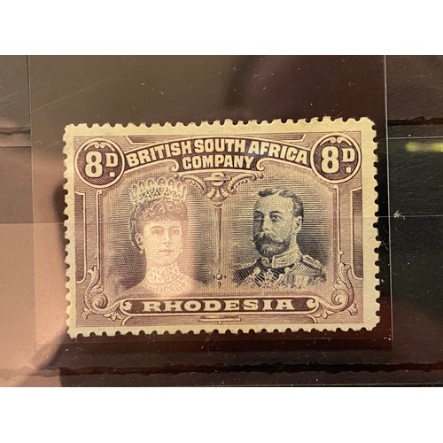 83 - Rhodesia - 1910-13 Double head issue perforated 13½ 8d. black and purple, [2] Long gash in Queen's e... 