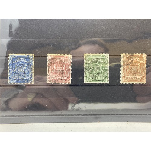 82 - Rhodesia- Rhodesia- 1892-93, £1, £2, £5, and £10 used, some toning to the perfs on the £1 and £5 nev... 