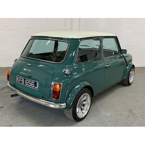 59 - 1971 Mini Cooper S Recreation 
Registration number KFB 656J 
Green with a white roof 
Black interior... 