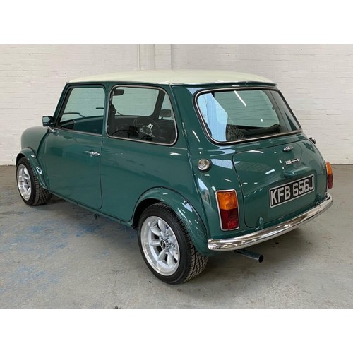 59 - 1971 Mini Cooper S Recreation 
Registration number KFB 656J 
Green with a white roof 
Black interior... 