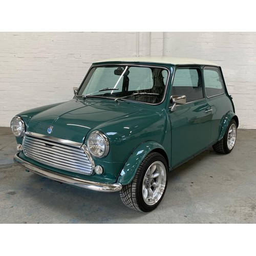 59 - 1971 Mini Cooper S Recreation 
Registration number KFB 656J 
Green with a white roof 
Black interior... 