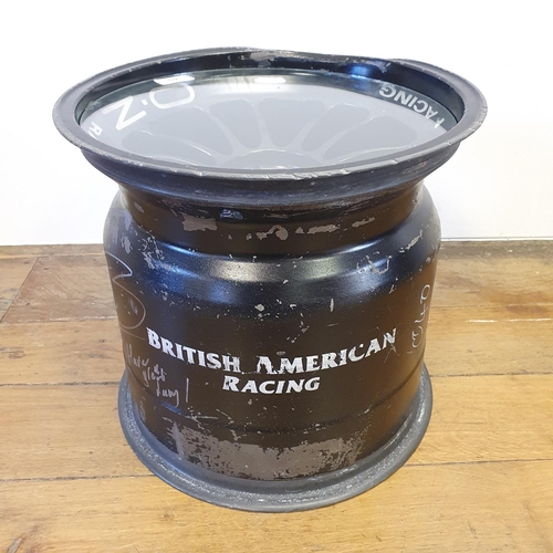 40 - An F1 BAR British American Racing wheel, used and dented by Jenson Button and signed by him while he...