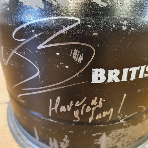 40 - An F1 BAR British American Racing wheel, used and dented by Jenson Button and signed by him while he...