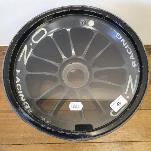 40 - An F1 BAR British American Racing wheel, used and dented by Jenson Button and signed by him while he...