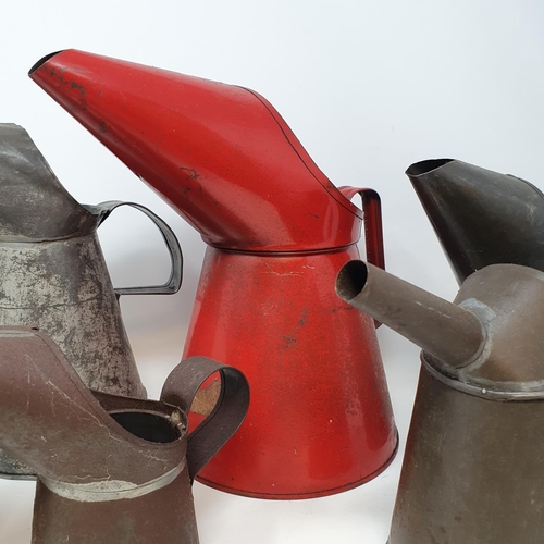 48 - A red painted oil can, 26 cm high, six other oil cans, and a commercial vehicle wing mirror (box)...