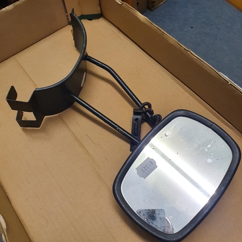 48 - A red painted oil can, 26 cm high, six other oil cans, and a commercial vehicle wing mirror (box)...