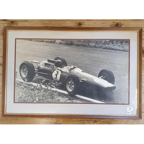 55 - A monochrome picture, Jim Clark driving a Lotus, 39 x 69.5 cm...