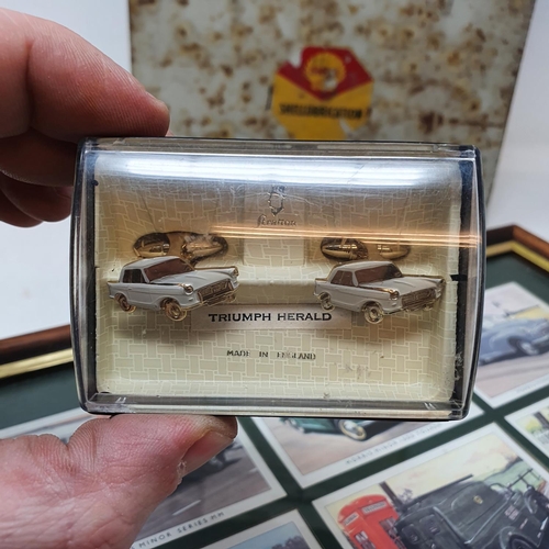 56 - A Shell SHELLUBRICATION box with charts, 23 cm wide, a pair of Triumph Herald cufflinks, and a set o...