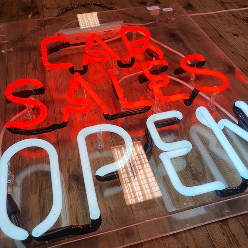 8 - A modern neon sign, CAR SALES OPEN, in a perspex case, 66 cm high x 56 cm wide...