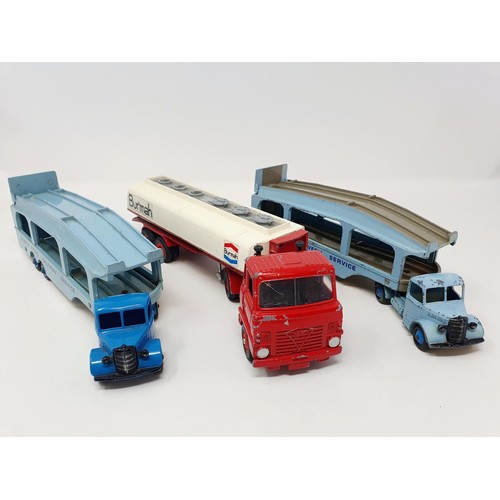 39 - Two Dinky Toys Pullmore car transporters, a Foden Burmah petrol tanker, and three tanks...