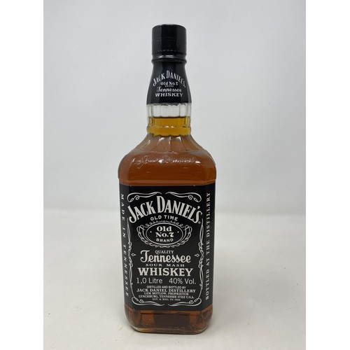 670 - A litre bottle of Jack Daniel's whiskey, two bottles of Jack Daniel's whiskey, and three bottles of ... 