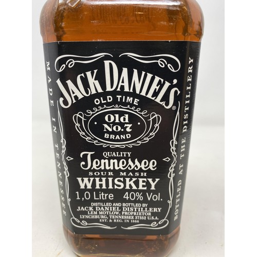 670 - A litre bottle of Jack Daniel's whiskey, two bottles of Jack Daniel's whiskey, and three bottles of ... 