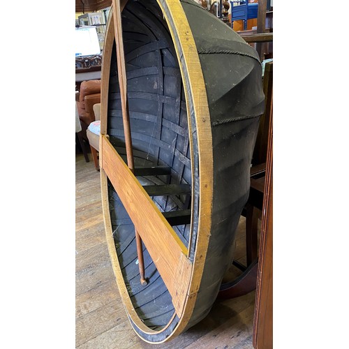 959 - A canvas coracle, 130 cm diameter