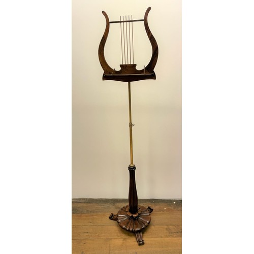 956 - A rosewood and brass music stand, with a lyre rest, 35 cm wide