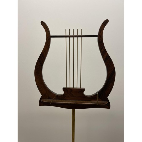 956 - A rosewood and brass music stand, with a lyre rest, 35 cm wide