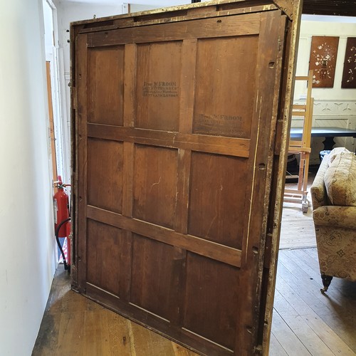 957 - A large late 19th century early 20th century carved and gilt mirror, 192 cm x 150 cm