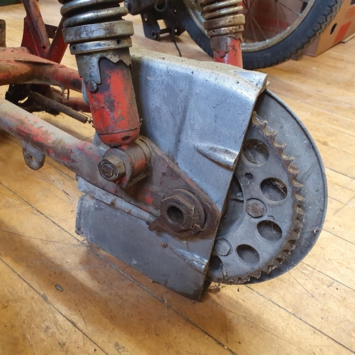 74 - A red painted frame, with a Bultaco engine