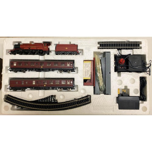 206 - A Hornby OO gauge 4-6-2 locomotive and tender, boxed, a Harry Potter electric train set, and a Mini ... 