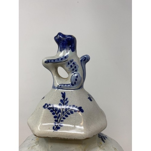 467 - A Delft vase and cover, 38 cm high, and another, 36 cm high (2)