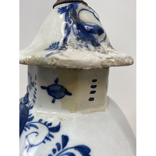 467 - A Delft vase and cover, 38 cm high, and another, 36 cm high (2)