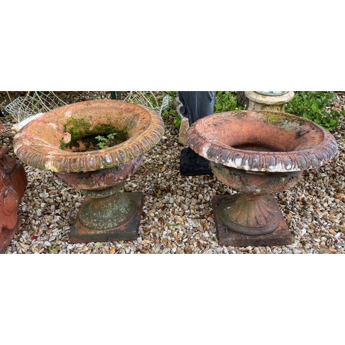 910 - A terracotta garden planter, 57 cm diameter, and another similar (2)