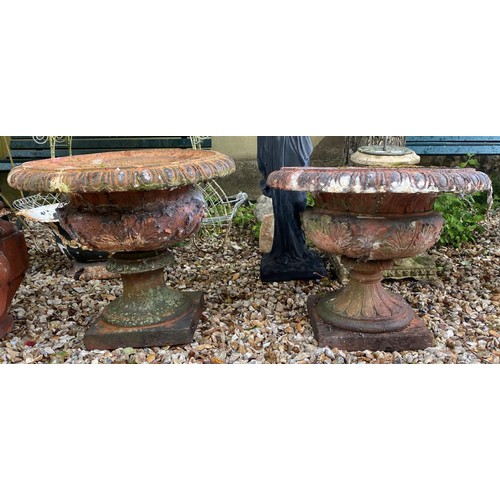 910 - A terracotta garden planter, 57 cm diameter, and another similar (2)