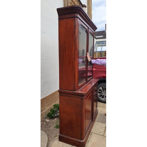 912 - A 19th century mahogany bookcase on cabinet, 138 cm wide