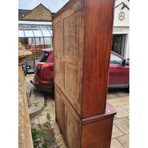 912 - A 19th century mahogany bookcase on cabinet, 138 cm wide