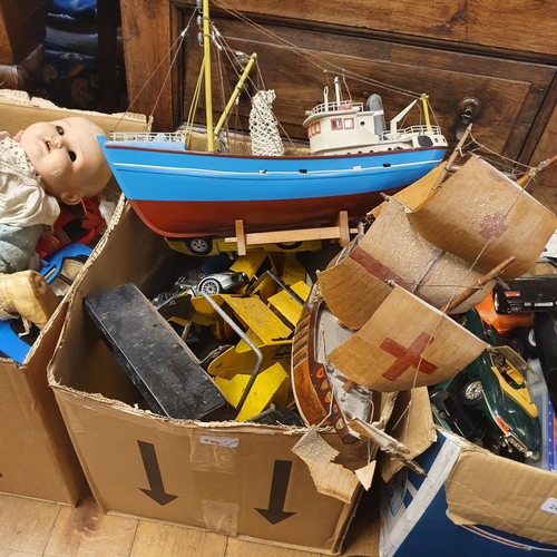 244 - Assorted Barbie dolls, a model boat, and various other toys (4 boxes)