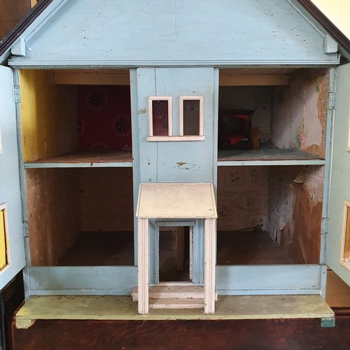 240 - A 1950s dolls house, 105 cm high x 83 cm wide