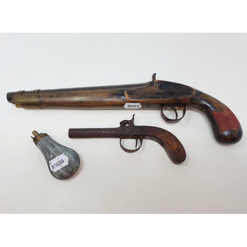 200A - A percussion cap pistol, with a beech stock, 38 cm, another similar, rusted, 18 cm, and a small shot... 