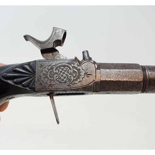 203 - An early 19th century percussion cap pistol, with a folding trigger and engraved decoration, 18 cm, ... 