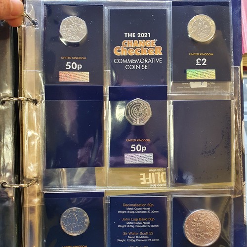 98 - A Change Checker album, with assorted coins