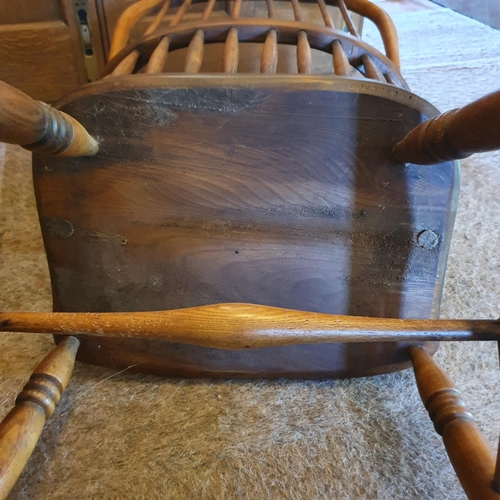 174 - A late Victorian kitchen beech and elm armchair, and a comb back rocking armchair (2)