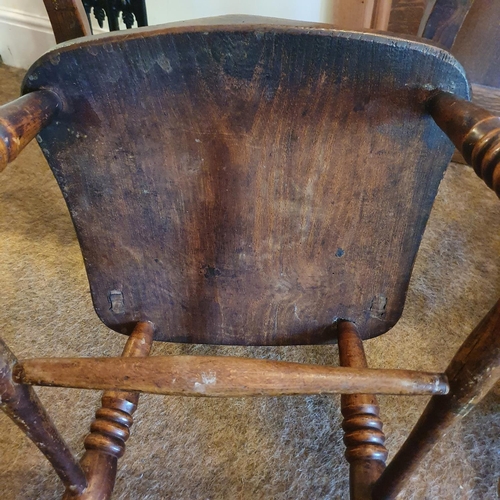 174 - A late Victorian kitchen beech and elm armchair, and a comb back rocking armchair (2)