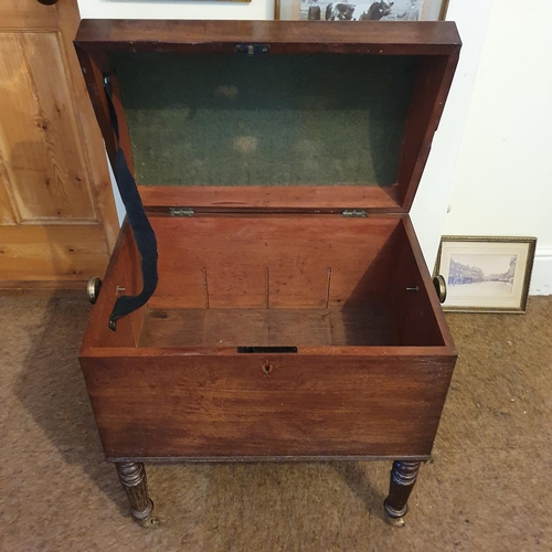 176 - A 19th century mahogany wine cellarette, the domed top inlaid with a shell, on turned and reeded leg... 