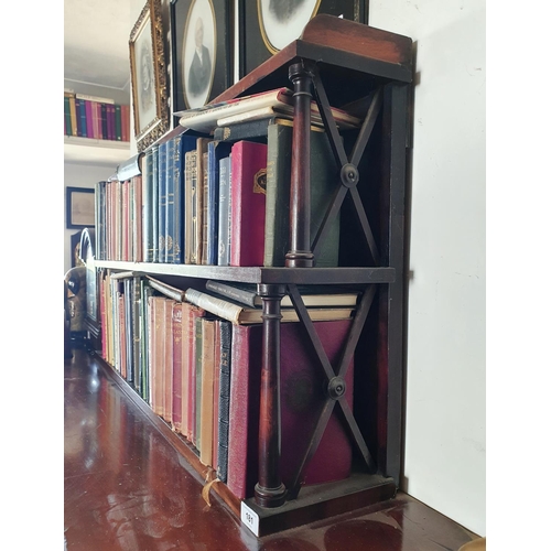 181 - A 19th century style mahogany two tier bookcase, on turned supports, 96 cm wide, including the books