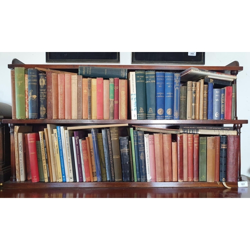 181 - A 19th century style mahogany two tier bookcase, on turned supports, 96 cm wide, including the books