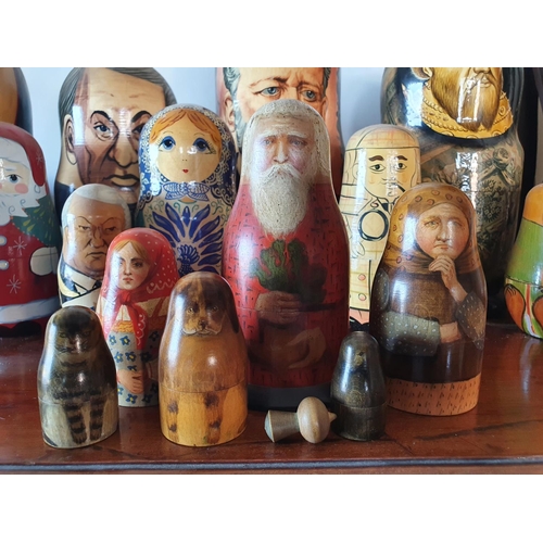 184 - A group of ten Russian stacking dolls, the largest 25 cm high