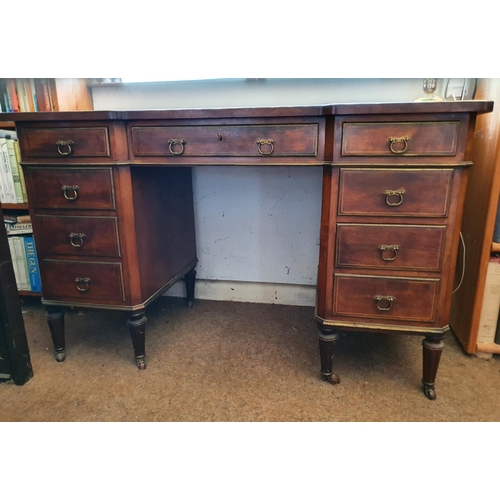 191 - An early 20th century Edwards & Roberts walnut desk, of inverted breakfront form, the inset top abov... 