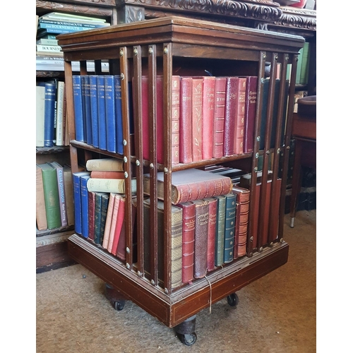 193 - A revolving bookcase, veneered in walnut, 50 cm wide