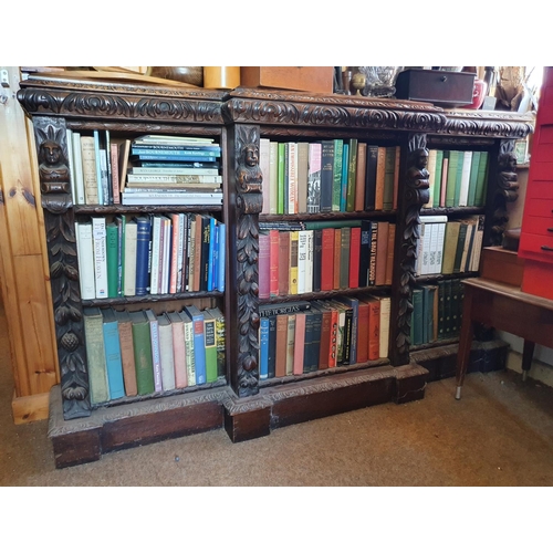 194 - A late Victorian oak breakfront bookcase, carved figures and foliage in high relief, 183 cm wide x 1... 