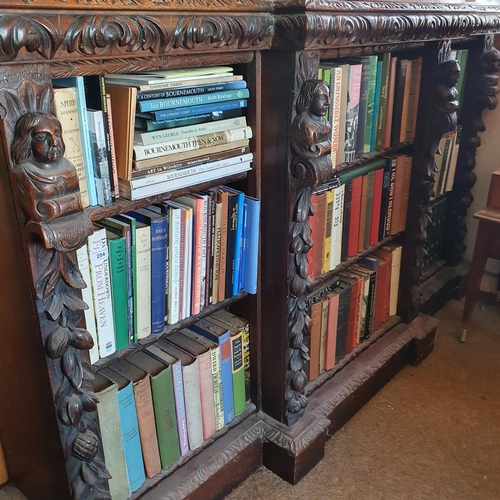 194 - A late Victorian oak breakfront bookcase, carved figures and foliage in high relief, 183 cm wide x 1... 