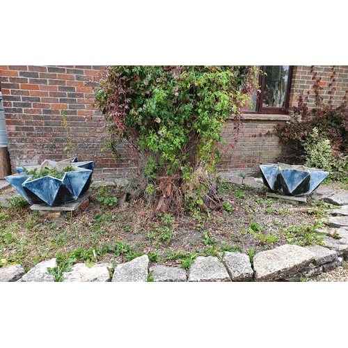 2 - A pair of fibreglass type garden planters, of star form, some damage/repairs, 84 cm wide (2)...