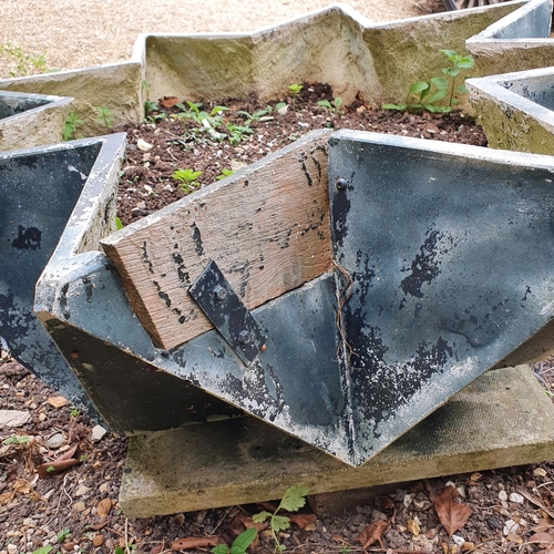 2 - A pair of fibreglass type garden planters, of star form, some damage/repairs, 84 cm wide (2)...