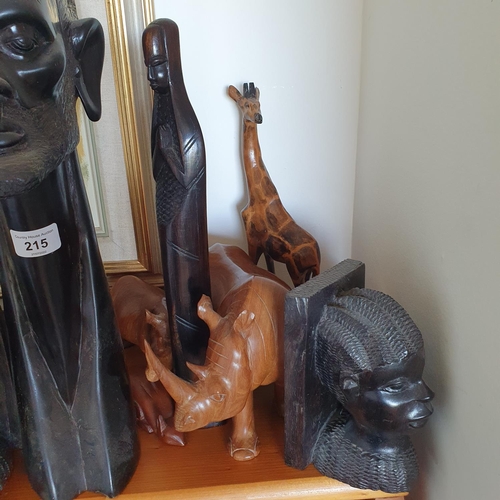 215 - The Snug. 
A group of African wood carvings (qty)