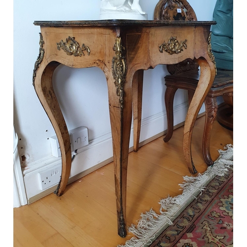 217 - A Louis XVI style walnut table, of serpentine outline, having a frieze drawer, on cabriole legs, 62 ... 