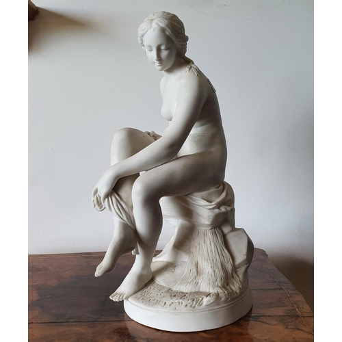 218 - A late Victorian parian ware figure, the bather, 41 cm high