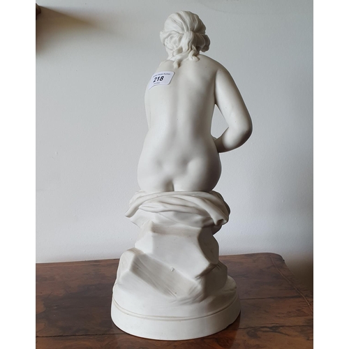 218 - A late Victorian parian ware figure, the bather, 41 cm high