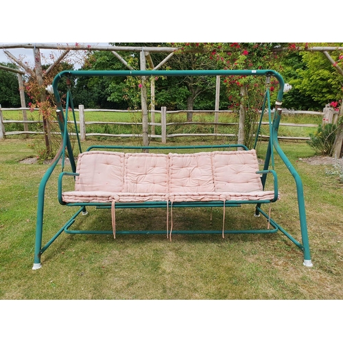 22 - A green painted garden swing, some surface rust and cushions faded...